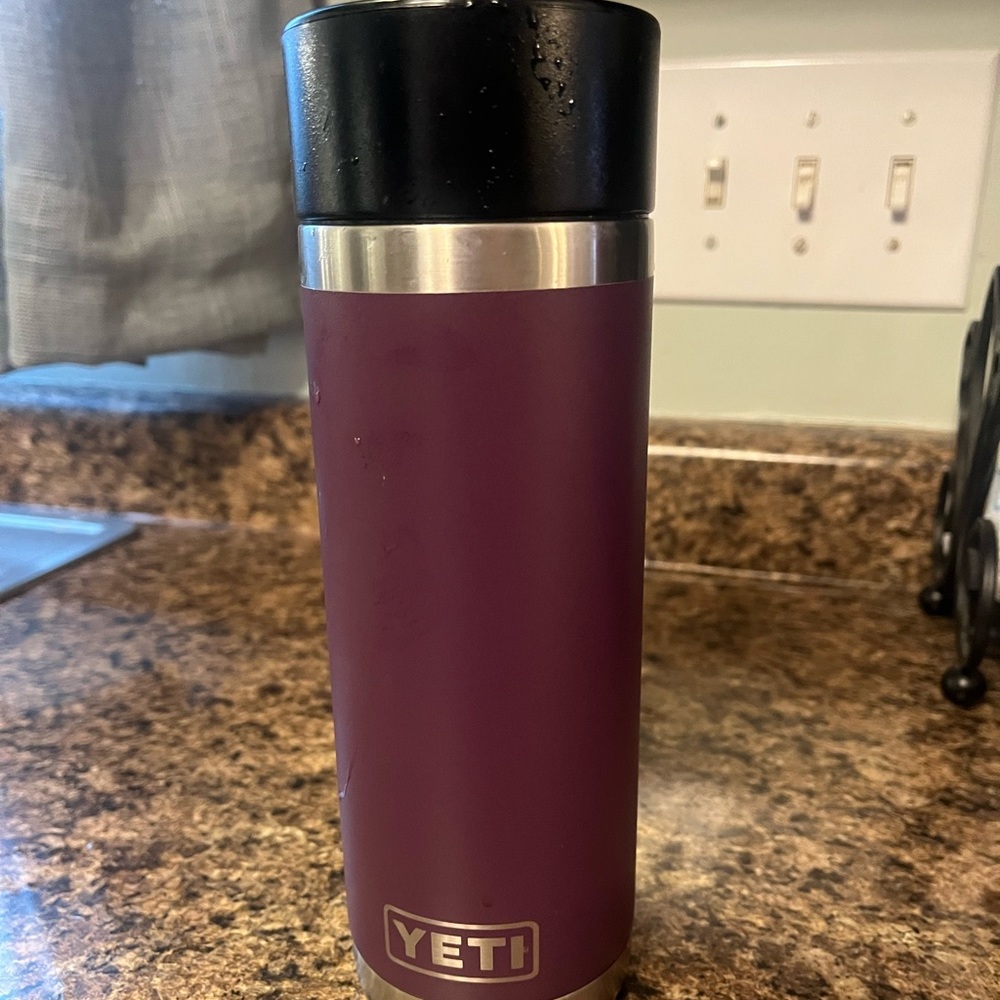 18 ounce dark purple, yeti brand Tumbler with spill proof lid